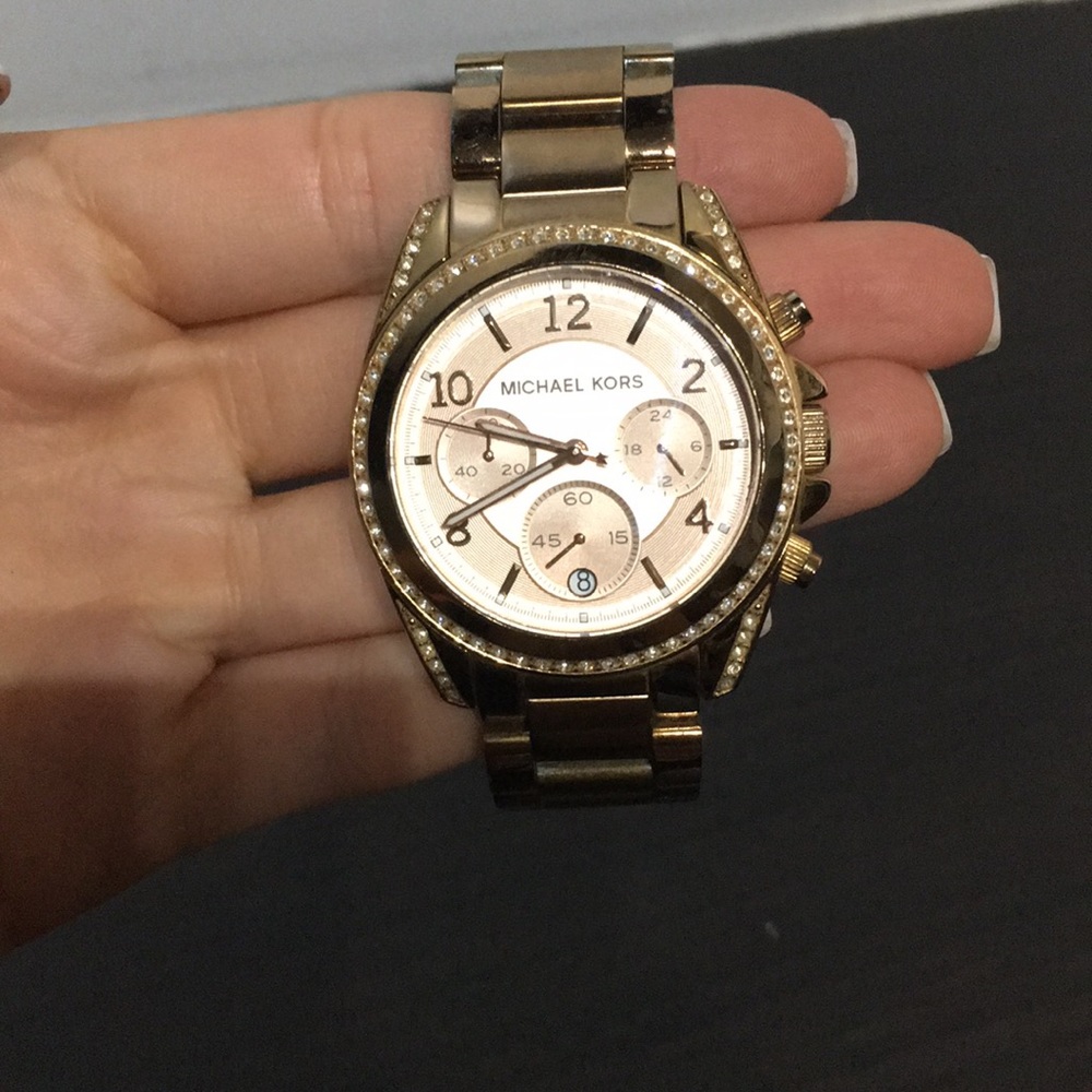 Gold Michael Kors watch with gem stone face